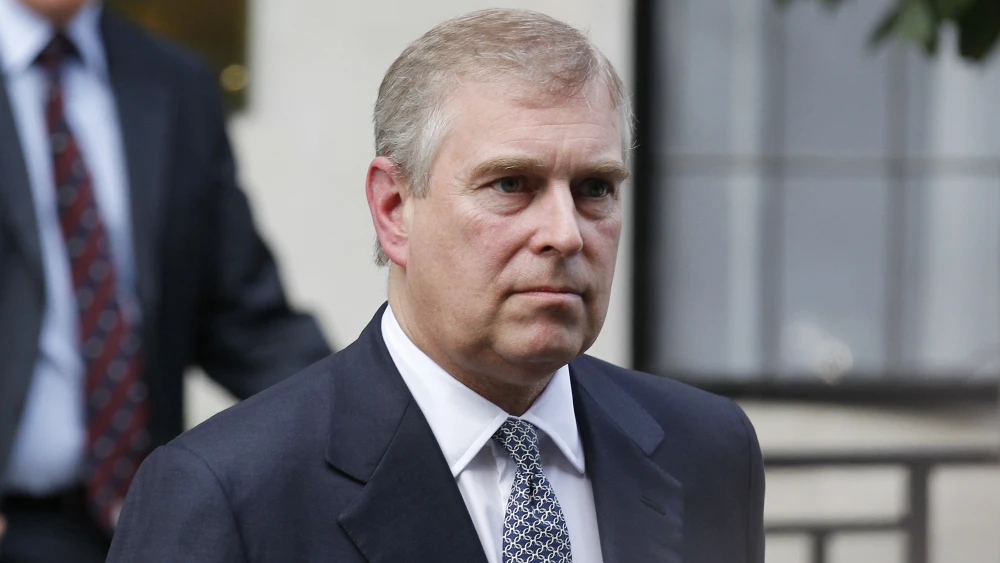 Man in dark suit with serious expression